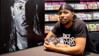 Jme signing copies of his album Grime MC