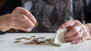 Older woman counting coins