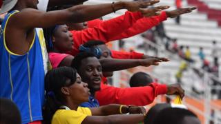 Congo's supporters sing their national anthem at the Felix Houphouet-Boigny in Abidjan during the eighth "Jeux de la Francophonie" (French Speaking) Games on July 24, 2017 in Ivory Coast.