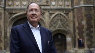 Gregory Winter, poses for photographs after being awarded the Noble Prize for Chemistry, outside Trinity College Cambridge