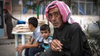 Displaced Syrian man and children in Hasakeh, north-east Syria (24/10/19)