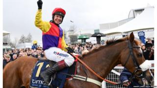 Jockey Richard Johnson celebrates after winning the Timico Cheltenham Gold Cup Steeple Chase on Native River during Day Four of the Cheltenham Racing Festival