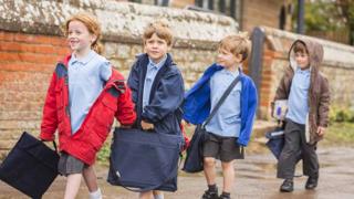 Happy children going to school