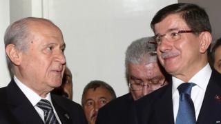 Turkey's Prime Minister Ahmet Davutoglu (right) with Nationalist Movement Party (MHP) opposition leader Devlet Bahceli (left)