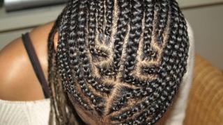 Girl wearing cornrows