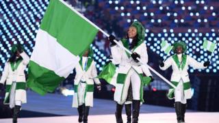Flag bearer Ngozi Onwumere of Nigeria leads the team during the Opening Ceremony