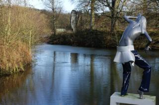 Statues by water