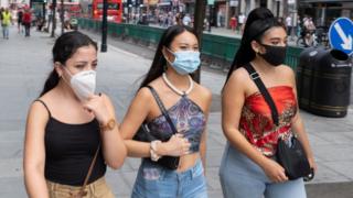 As Britain enters a period of deep recession, with some shops closing either temporarily or permanently as the economic downturn caused by the Covid-19 pandemic cuts hard, shoppers wearing face masks continue to come to the West End to Oxford Street on 13th August 2020 in London, United Kingdom.