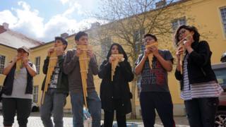 The group rehearsing in the palace grounds