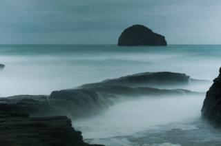 Waves crashing on rocks