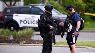 Image shows police officers standing