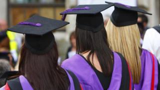 Three students in mortar boards