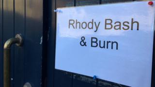 Rhody bash and burn sign