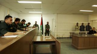 File photo showing Palestinian military court judges overseeing the trial of three men accused of murder in Gaza in November 2007