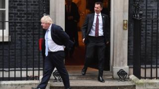 Boris Johnson and Jeremy Hunt leave 10 Downing Street.