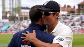 Alastair Cook hugs a colleague at The Oval