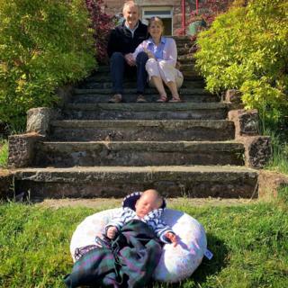 Grandparents meet their new grandchild