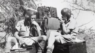 Second world war image of two British soldiers communicating with base while on field operations in East Africa.