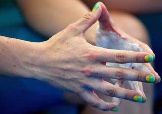 Ashlee Ankudinoff of Australia holds her hands together at a cycling event
