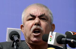 Abdul Rahid Dostum addresses a crowd in the outskirts of Kunduz province, north of Kabul, on March 19, 2014.