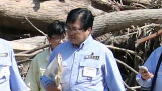 Shunsuke Mutai, Japan's vice minister of reconstruction, visits Iwaizumi, a northern Japanese town devastated by a deadly storm, northern Japan.