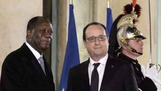 French President Francois Hollande (C,R) welcomes Ivory Coast"s president Alassane Ouattara prior to their meeting on February 4, 2016 at the Elysee Presidential Palace in Paris.