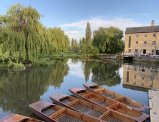 Reflection of boats and trees in water