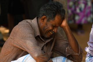 A relative of a Sri Lankan victim of an explosion at a church weeps outside a hospital in Batticaloa