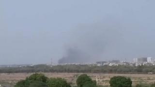 A picture from social media shows smoke billowing from the crash site