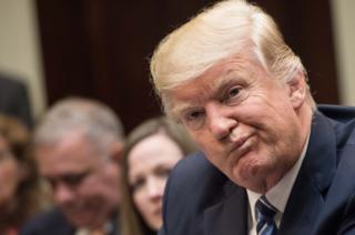 US President Donald Trump attends a meeting about healthcare in the Roosevelt Room at the White House in Washington, DC, on 13 March, 2017.