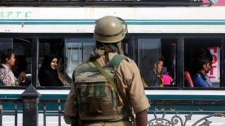 An Indian paramilitary soldier stands guard at the City Center, Lal Chowk, in Srinagar, the summer capital of Indian Kashmir, 02 June 2015