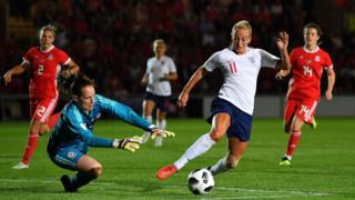 Toni Duggan of England goes around Laura O'Sullivan of Wales during the Women's World Cup qualifier between Wales Women and England Women at Rodney Parade on August 31, 2018 in Newport, Wales.