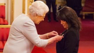 Jayne Senior receiving her MBE medal from the Queen at a Buckingham Palace investiture ceremony on 8 November 2016