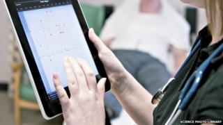 A doctor using a tablet