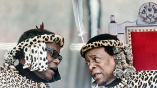 Inkatha Freedom Party ( IFP) leader Prince Mangosuthu Buthelezi (L) and Zulu King Goodwill Zwelithini (R) chat at The Moses Mabhida Football Stadium in Durban on 7 October 2018.