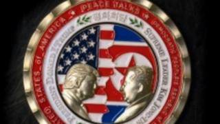 A commemorative coin issued by the White House, depicting Mr Trump and Mr Kim facing each other in front of a background of US and North Korean flags. The words "Peace Talks" are emblazoned at the top of the front of the coin with the date "2018" beneath.