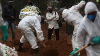 Madalena Cruz da Silva reacts during the burial of her son in Sao Paulo