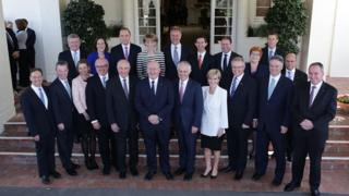 Australian Prime Minister Malcolm Turnbull poses with his new Cabinet at Government House in Canberra