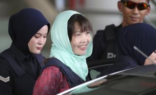 Vietnamese Doan Thi Huong smiles as she is escorted by Malaysian police at the Shah Alam High Court on 1 April, 2019
