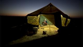 Woman and child refugee in a tent (Image: AP)