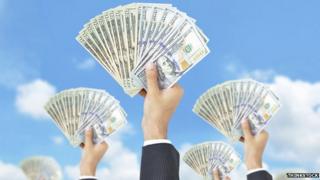 Picture of many hands holding money