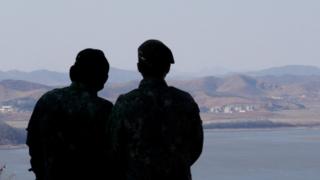 South Korean army soldiers watch the North Korean side at the unification observation post in Paju, near the border with North Korea, South Korea, 23 February