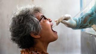 A woman is tested for coronavirus in Bangkok, Thailand - 28 April 2020