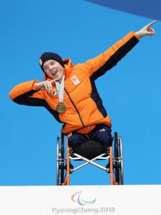 Gold medallist Jeroen Kampschreur poses on the podium after winning a gold medal