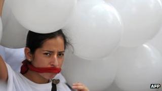 Participant at a rally in support of the private Venezuelan TV station Globovision