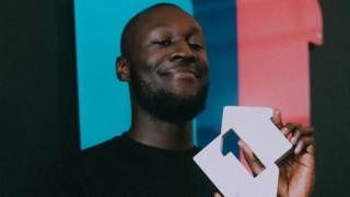 Stormzy with number one sign