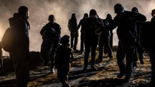 US border agents fire tear gas at migrants on the Mexican border