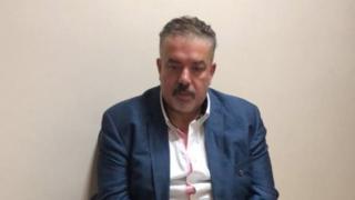 عوني مطيع بعد أن ألقي القبض عليه