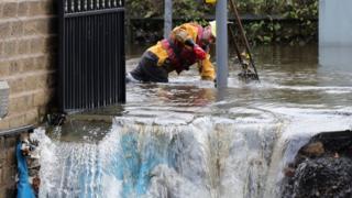 Fast flowing water caused havoc to some homes, and emergency services had to work overnight to clear flooded drains in Stalybridge, Greater Manchester.