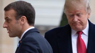 US President Donald Trump (R) is welcomed by French president Emmanuel Macron prior to their meeting at the Elysee Palace in Paris, 10 November 2018